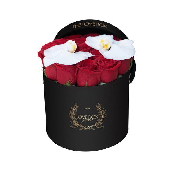 Red Roses with Orchid Flowers in Medium Black Box