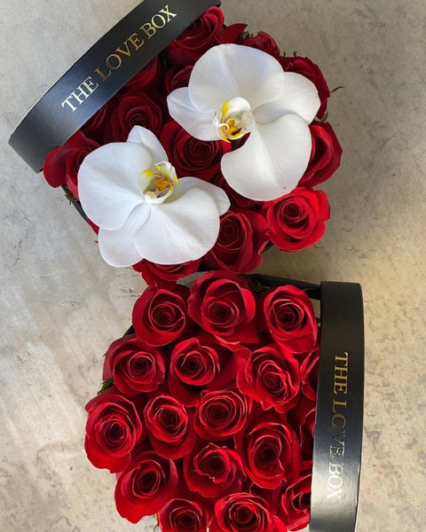 Red Roses with Orchid Flowers in Medium Black Box